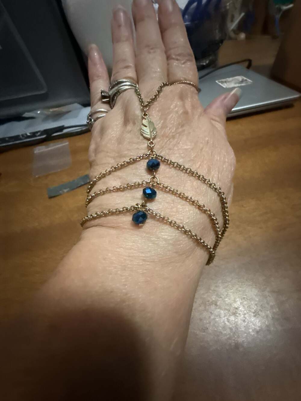 Gold-Tone Multi-Strand Chain Hand Bracelet with Blue Beads and Leaf Charm